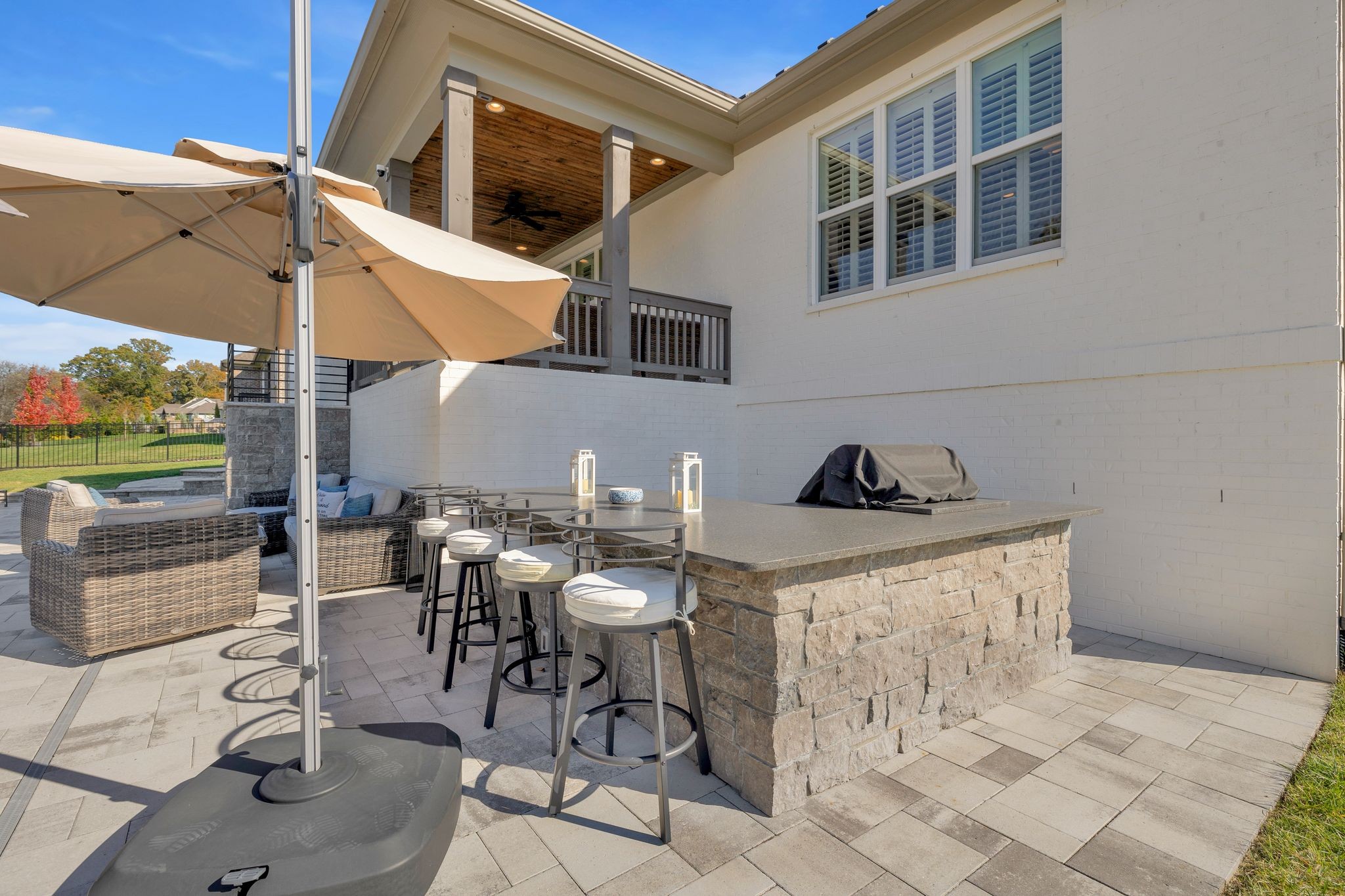 1032 Abbey Rd Way Spring Hill, TN 37174 - Photo 48 of 51 a view of a patio with table and chairs with barbeque grill and wooden fence