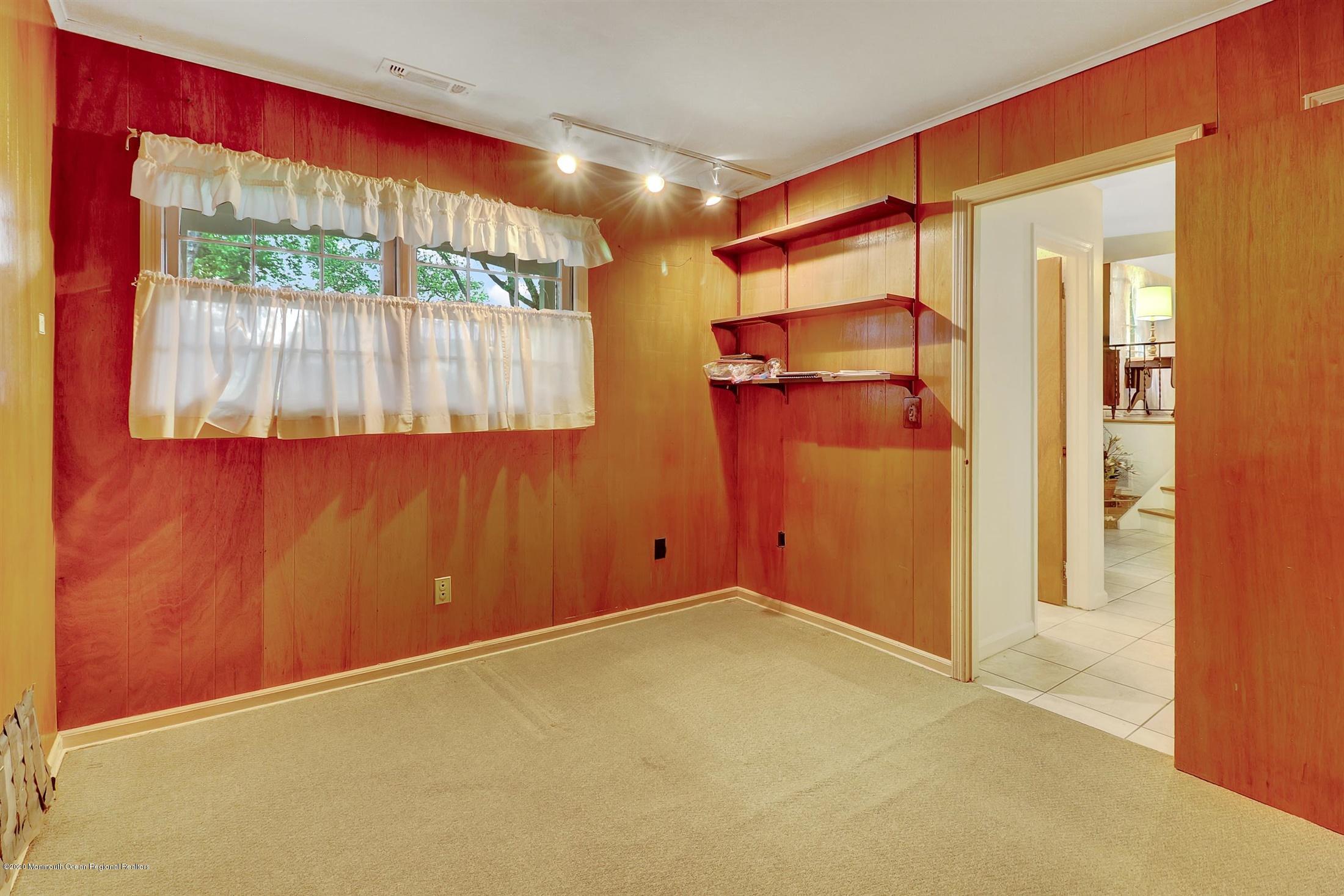 107 Jumping Brook Road Lincroft, NJ 07738 - Photo 17 of 30 en empty room with a window