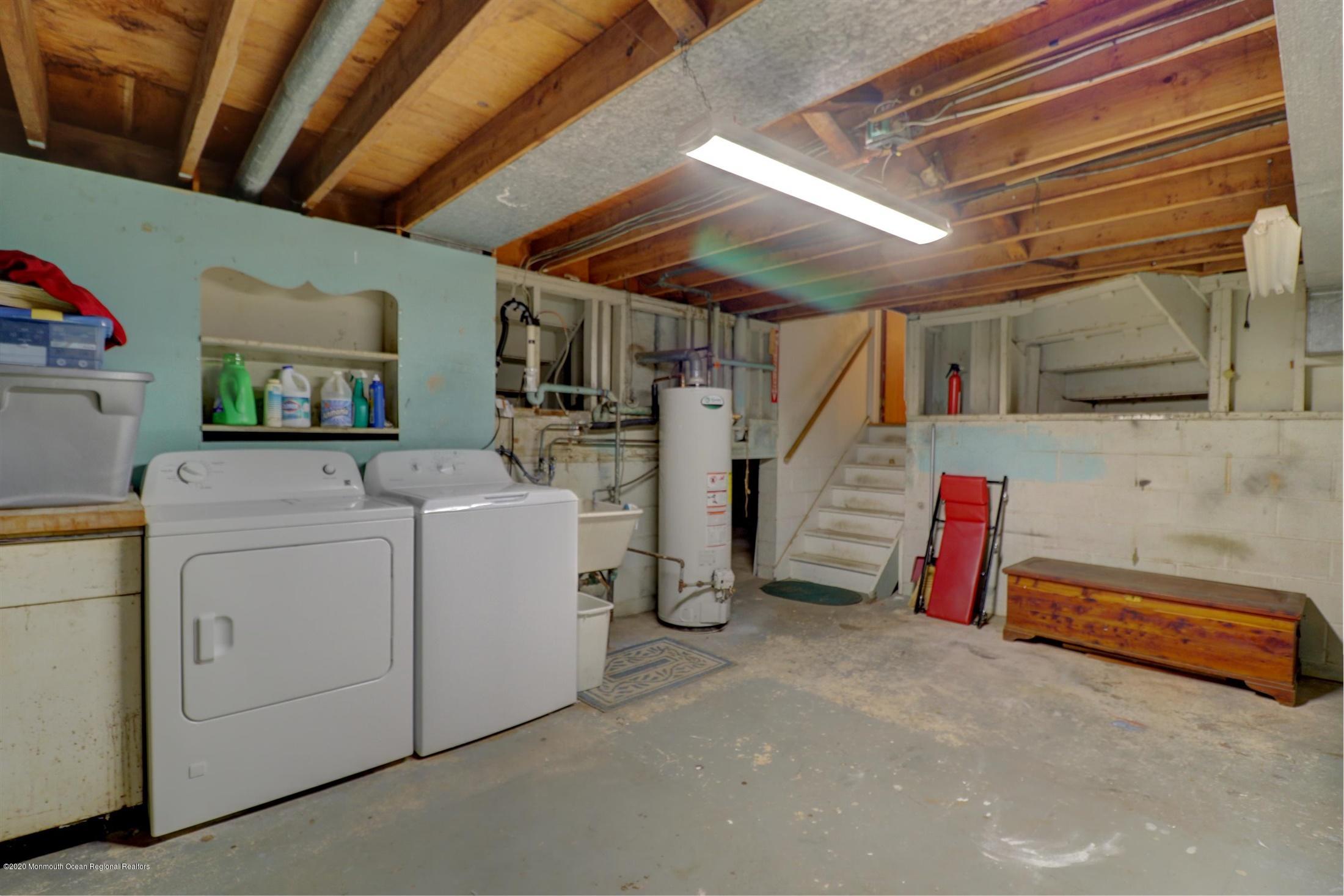 107 Jumping Brook Road Lincroft, NJ 07738 - Photo 29 of 30 a utility room with dryer and washer