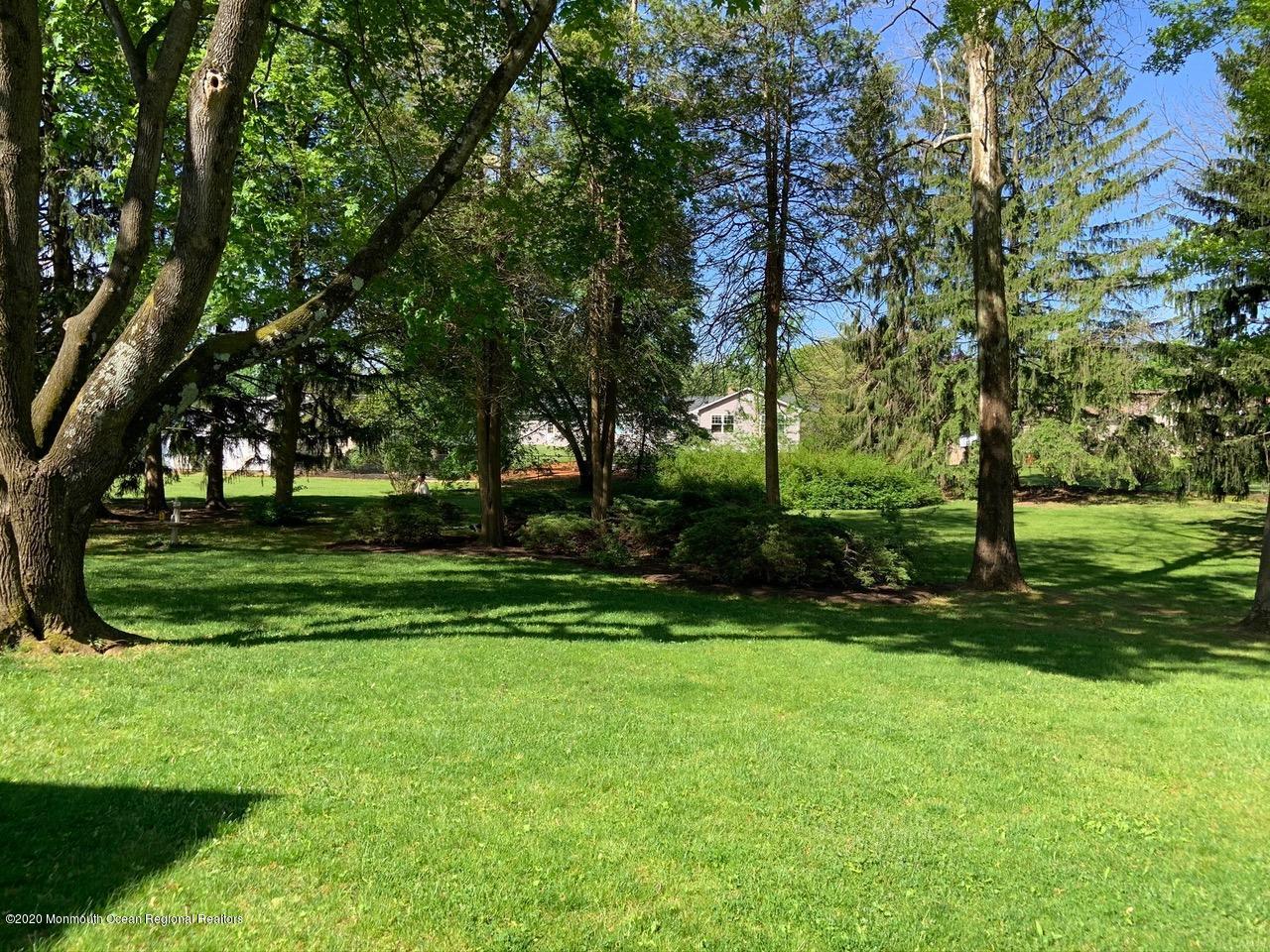107 Jumping Brook Road Lincroft, NJ 07738 - Photo 3 of 30 a view of a park