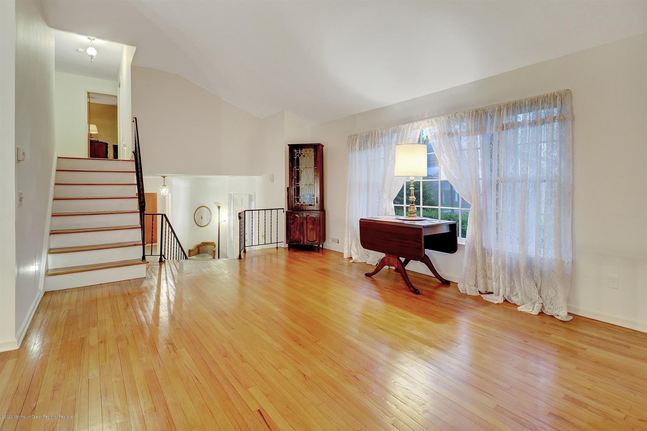 107 Jumping Brook Road Lincroft, NJ 07738 - Photo 8 of 30 a living room with furniture and a wooden floor