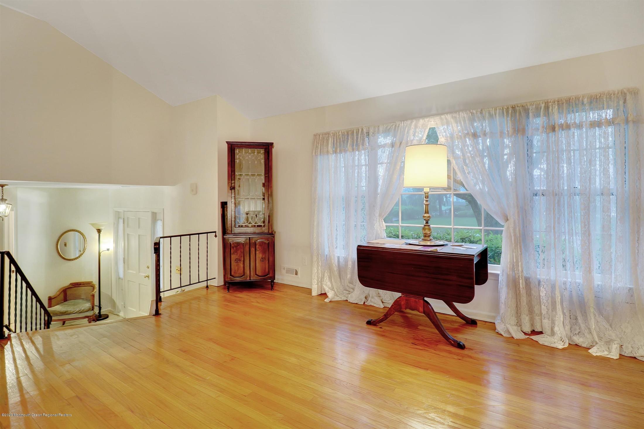107 Jumping Brook Road Lincroft, NJ 07738 - Photo 10 of 30 a living room with furniture and a window