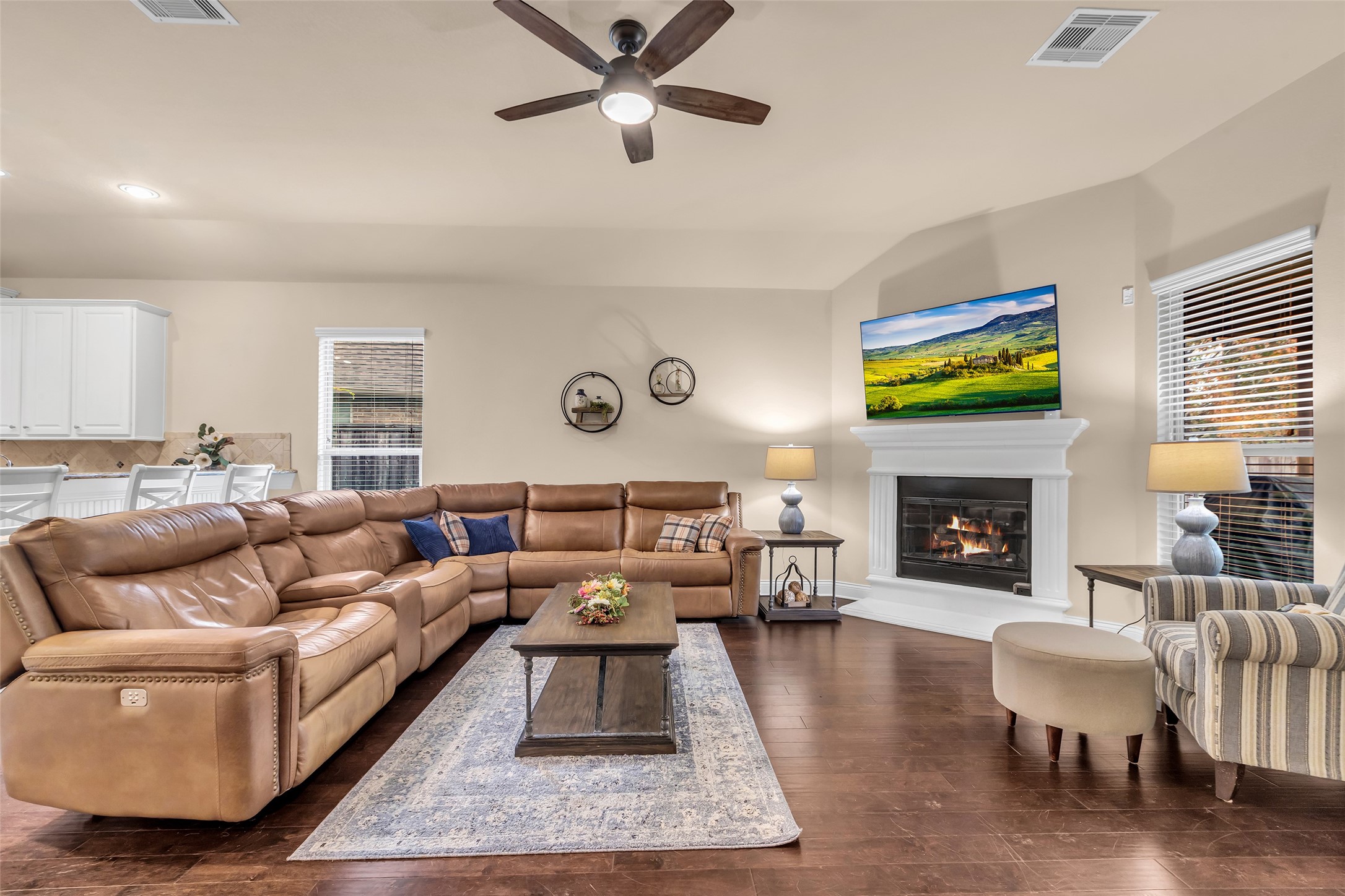 10 Pilot Rock Place Tomball, TX 77375 - Photo 13 of 23 a living room with furniture a fireplace and a flat screen tv