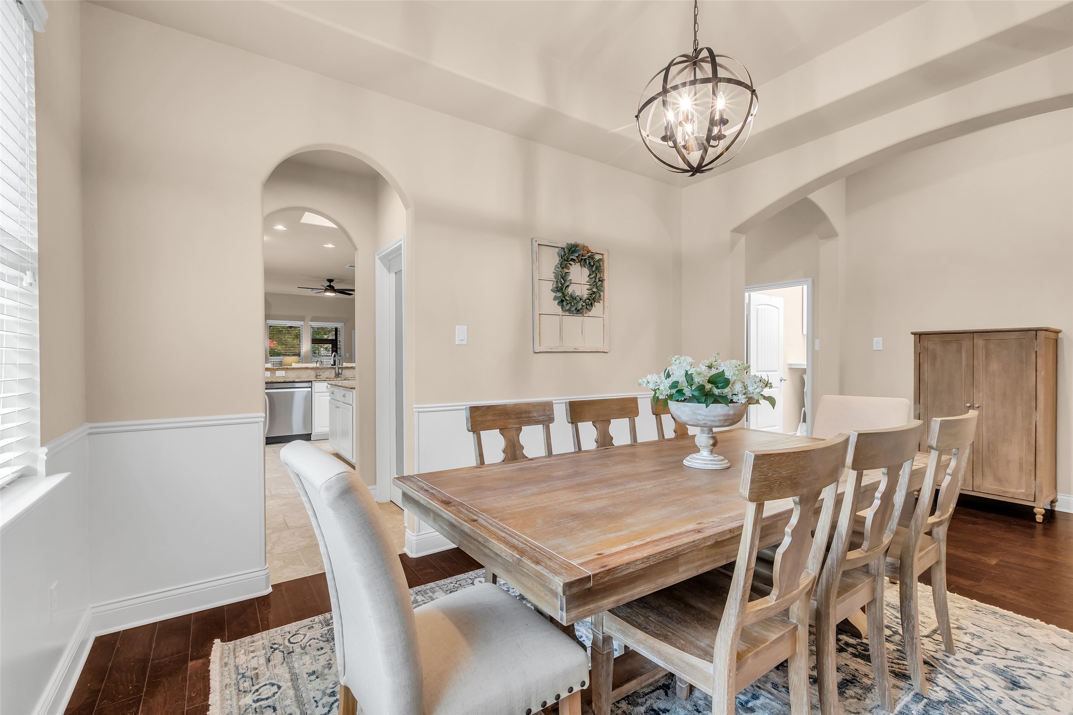 10 Pilot Rock Place Tomball, TX 77375 - Photo 3 of 23 a view of a dining room with furniture window and wooden floor