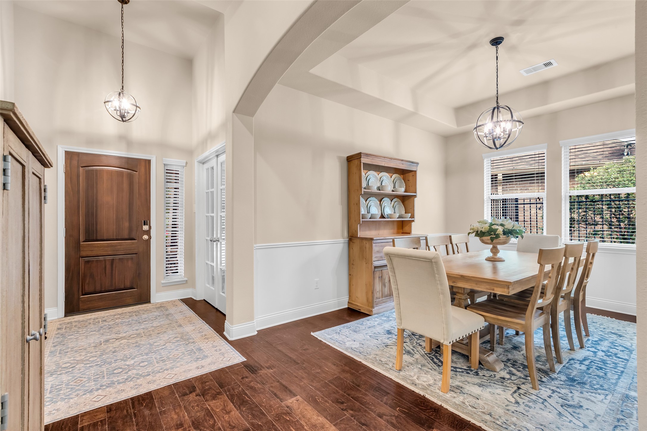 10 Pilot Rock Place Tomball, TX 77375 - Photo 4 of 23 a dining room with furniture a chandelier and wooden floor