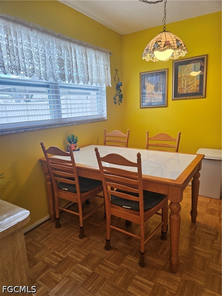 6777 Winkler Road, Unit 168 Fort Myers, FL 33919 - Photo 11 of 15 a view of a dining room with furniture and a window