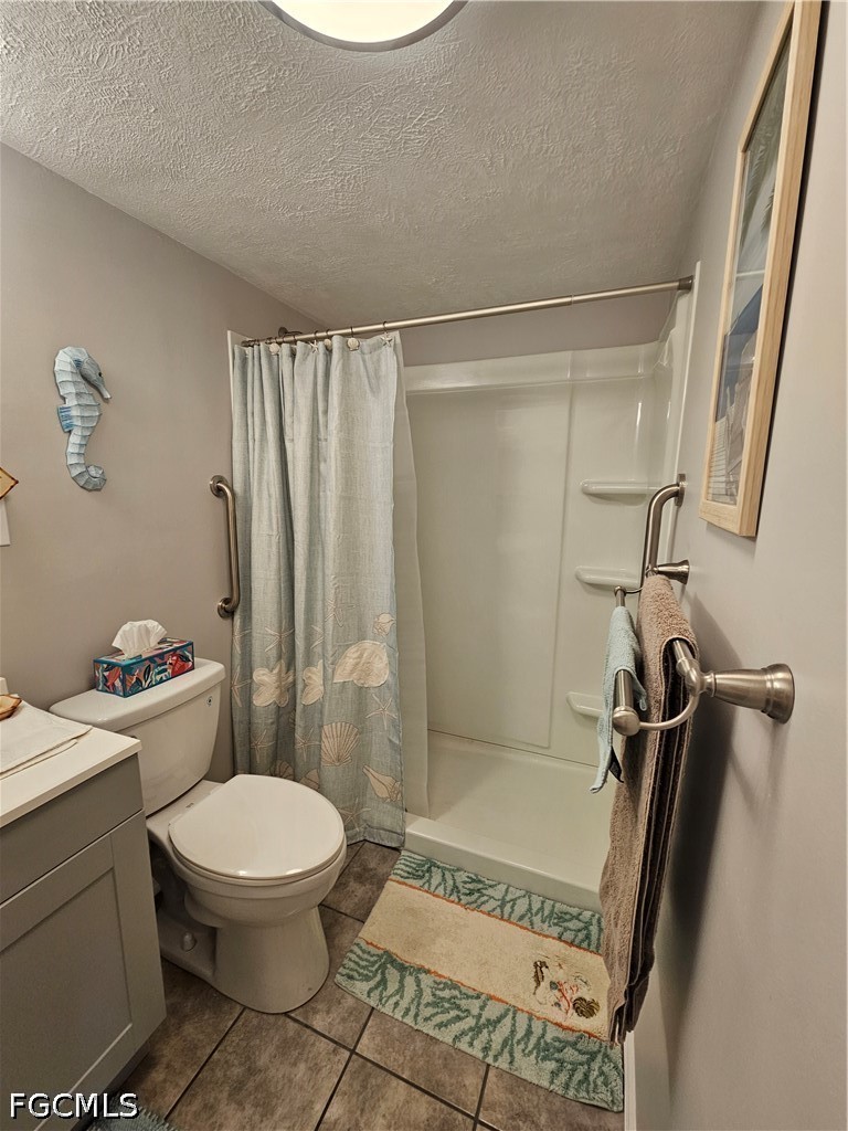 6777 Winkler Road, Unit 168 Fort Myers, FL 33919 - Photo 14 of 15 a bathroom with a toilet a sink and shower
