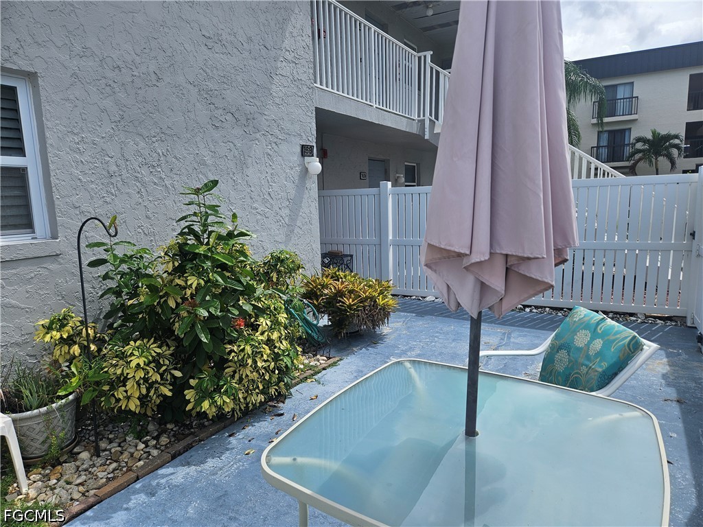 6777 Winkler Road, Unit 168 Fort Myers, FL 33919 - Photo 2 of 15 a view of backyard with outdoor seating and plants