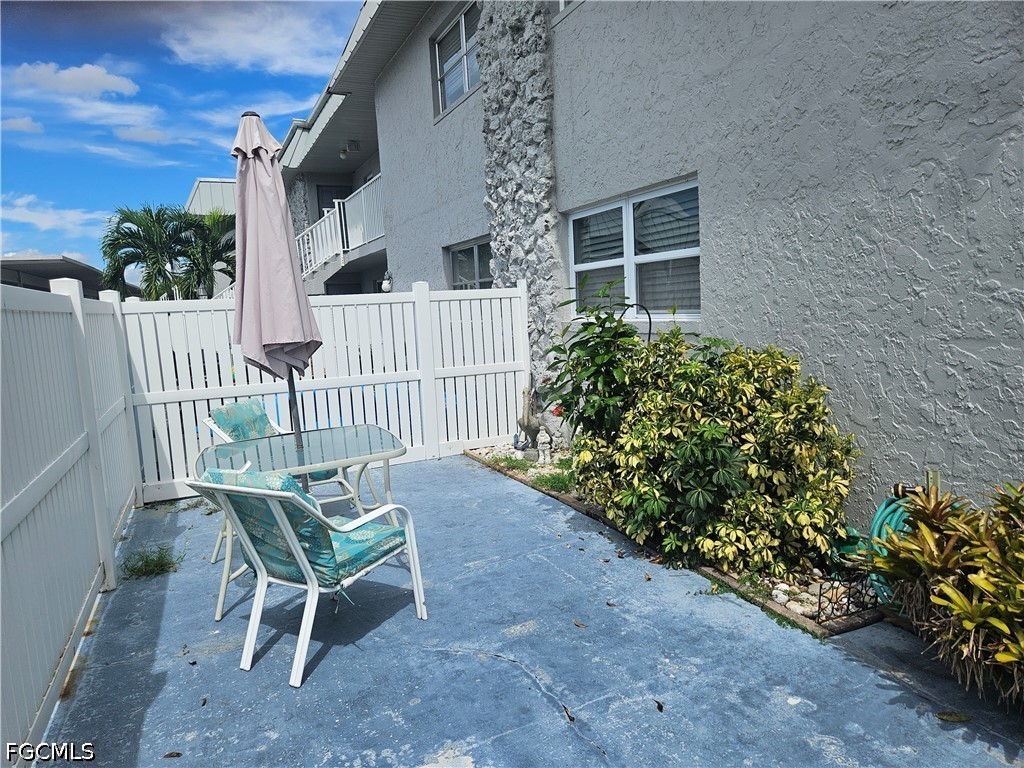 6777 Winkler Road, Unit 168 Fort Myers, FL 33919 - Photo 3 of 15 a view of a chair and table in the backyard