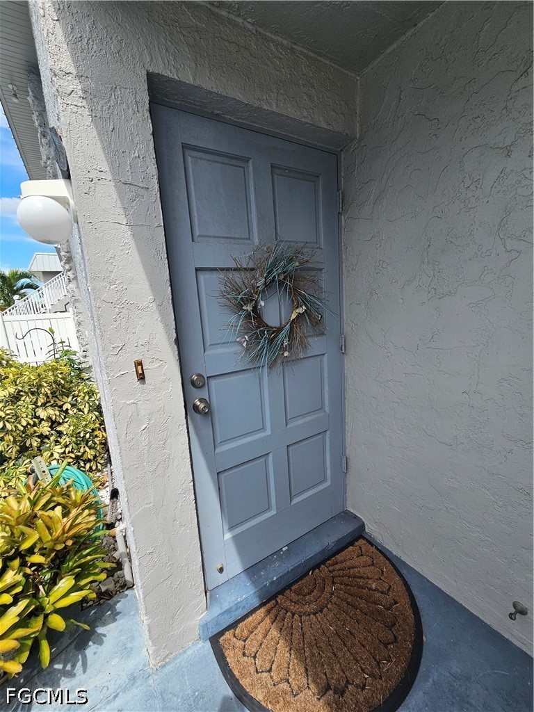 6777 Winkler Road, Unit 168 Fort Myers, FL 33919 - Photo 4 of 15 a view of entryway with a rug