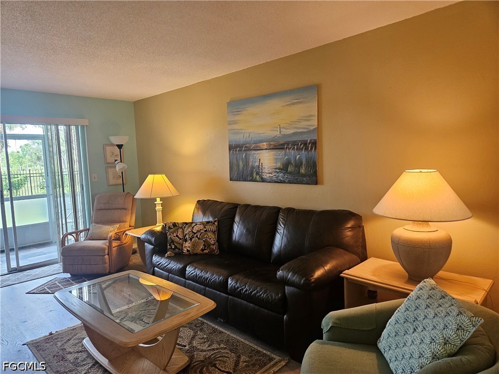 6777 Winkler Road, Unit 168 Fort Myers, FL 33919 - Photo 8 of 15 a living room with furniture and a window