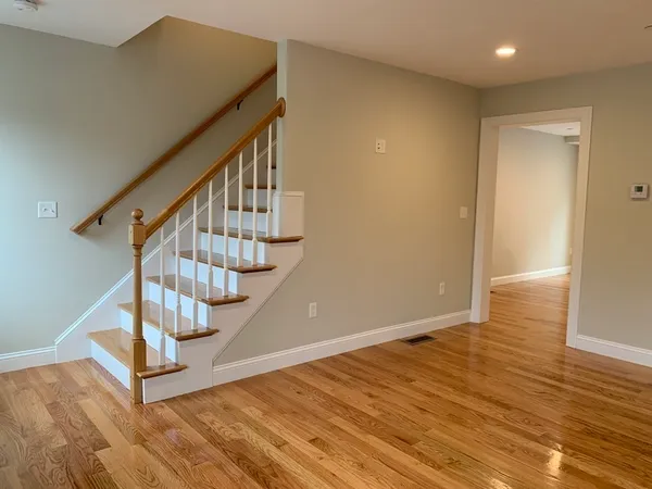 a view of entryway with wooden floor