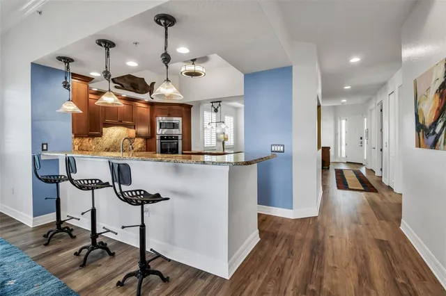 a view of a kitchen and dining room