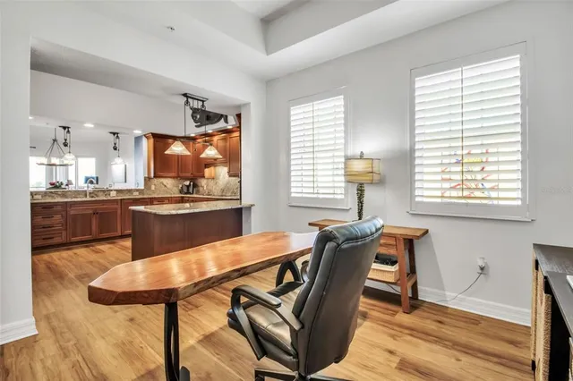 a dining room with furniture and window