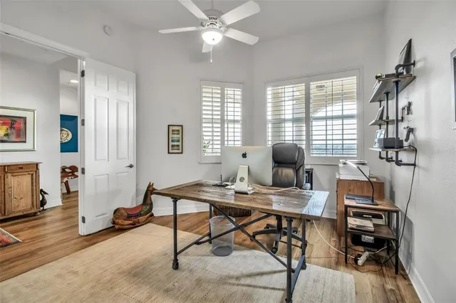 a work room with furniture and windows