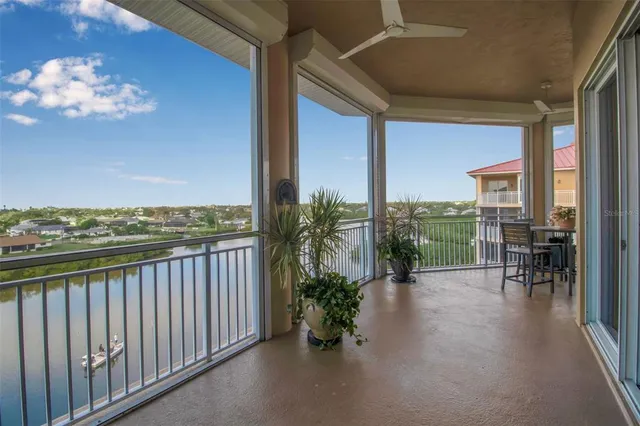a view of a balcony with chairs