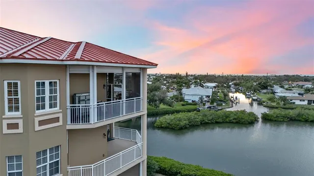 a view of a house with pool and a yard