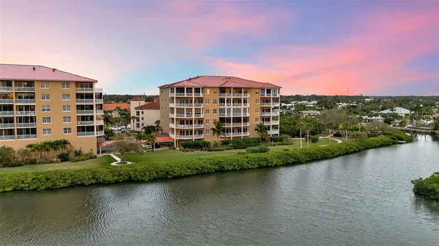 a view of a lake with a city skyline in the background