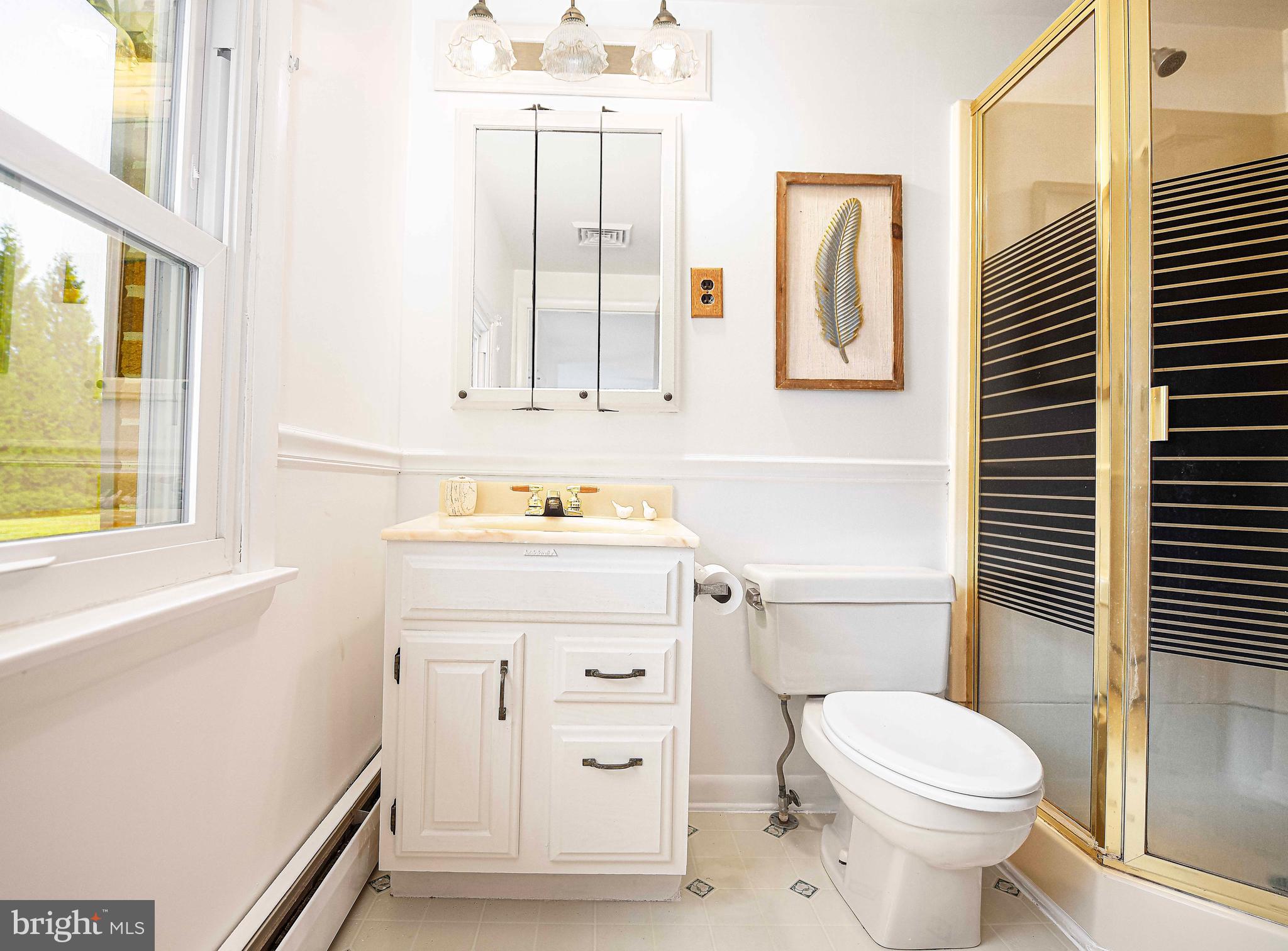 1710 Granite Road Darlington, MD 21034 - Photo 25 of 56 a bathroom with a sink toilet and window
