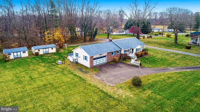 a aerial view of a house with a garden and plants