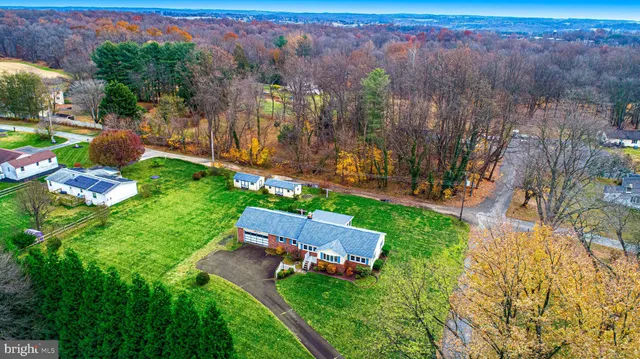 an aerial view of multiple house with a yard