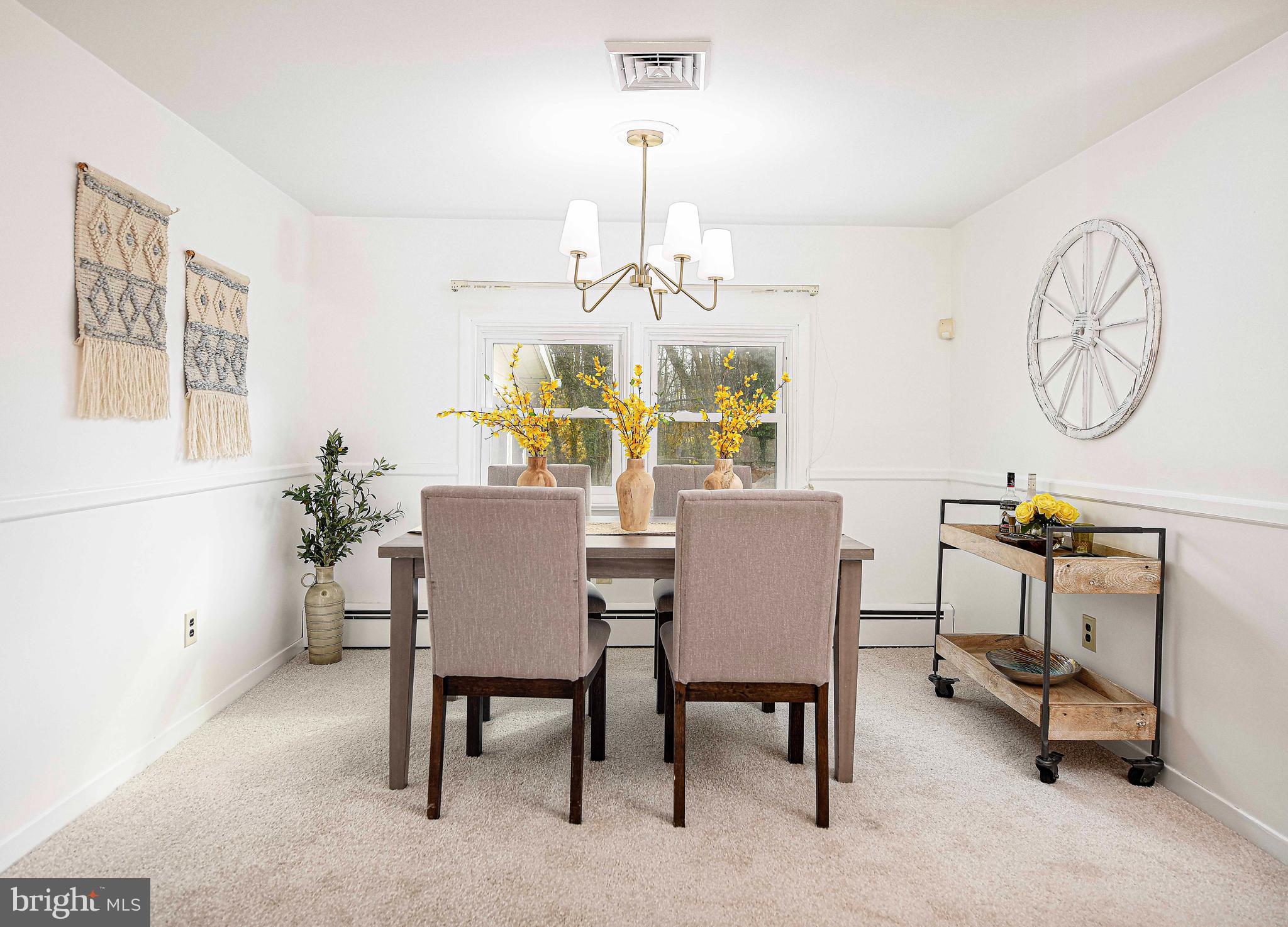 1710 Granite Road Darlington, MD 21034 - Photo 10 of 56 a view of a dining room with furniture and a chandelier