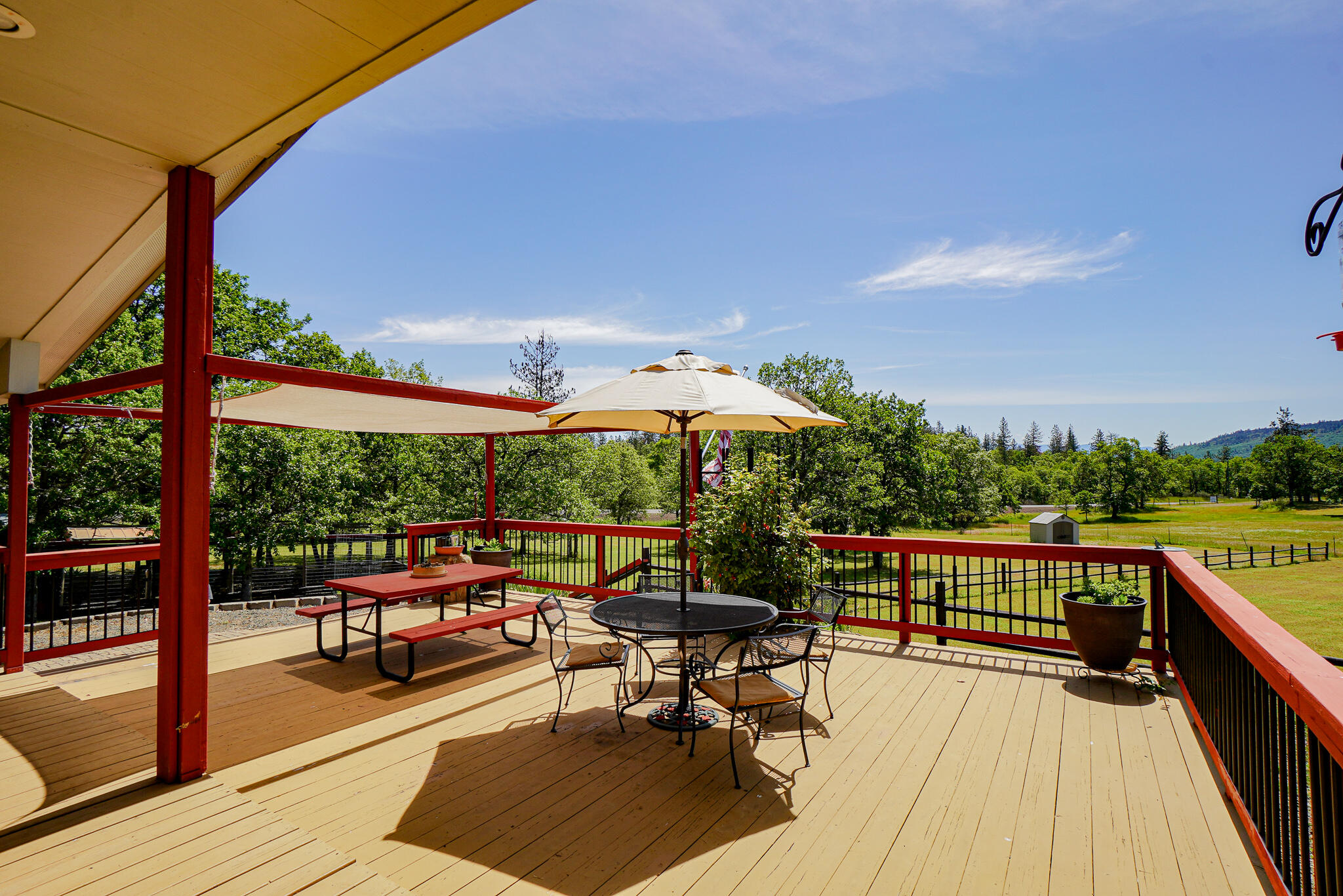 6297 Dodge Road White City, OR 97503 - Photo 33 of 45 an outdoor sitting area with furniture and umbrella