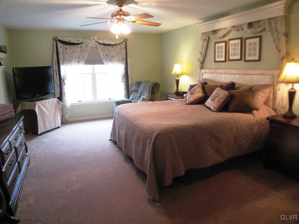 5912 Ricky Ridge Trail Orefield, PA 18069 - Photo 21 of 42 Master bedroom with ceiling fan/light combo