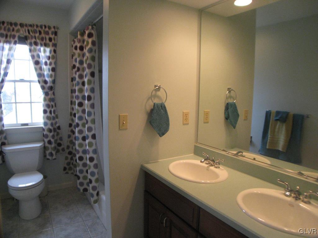 5912 Ricky Ridge Trail Orefield, PA 18069 - Photo 30 of 42 Hall bath with double vanity and tub/shower combo