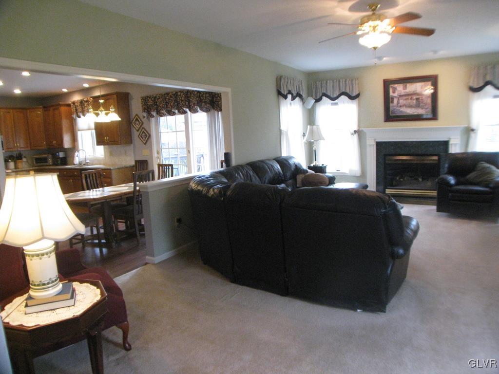 5912 Ricky Ridge Trail Orefield, PA 18069 - Photo 9 of 42 Family room with gas fireplace and ceiling fan/lig