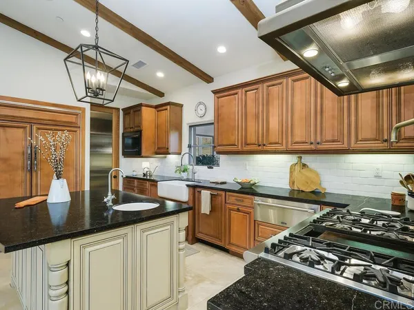 a kitchen with a table and chairs