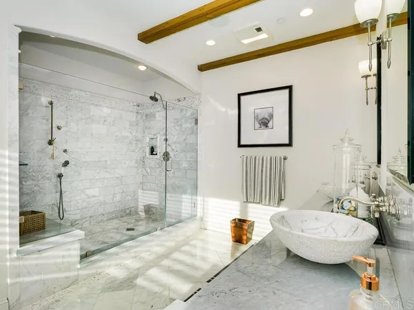 a bedroom with a bed and ceiling fan