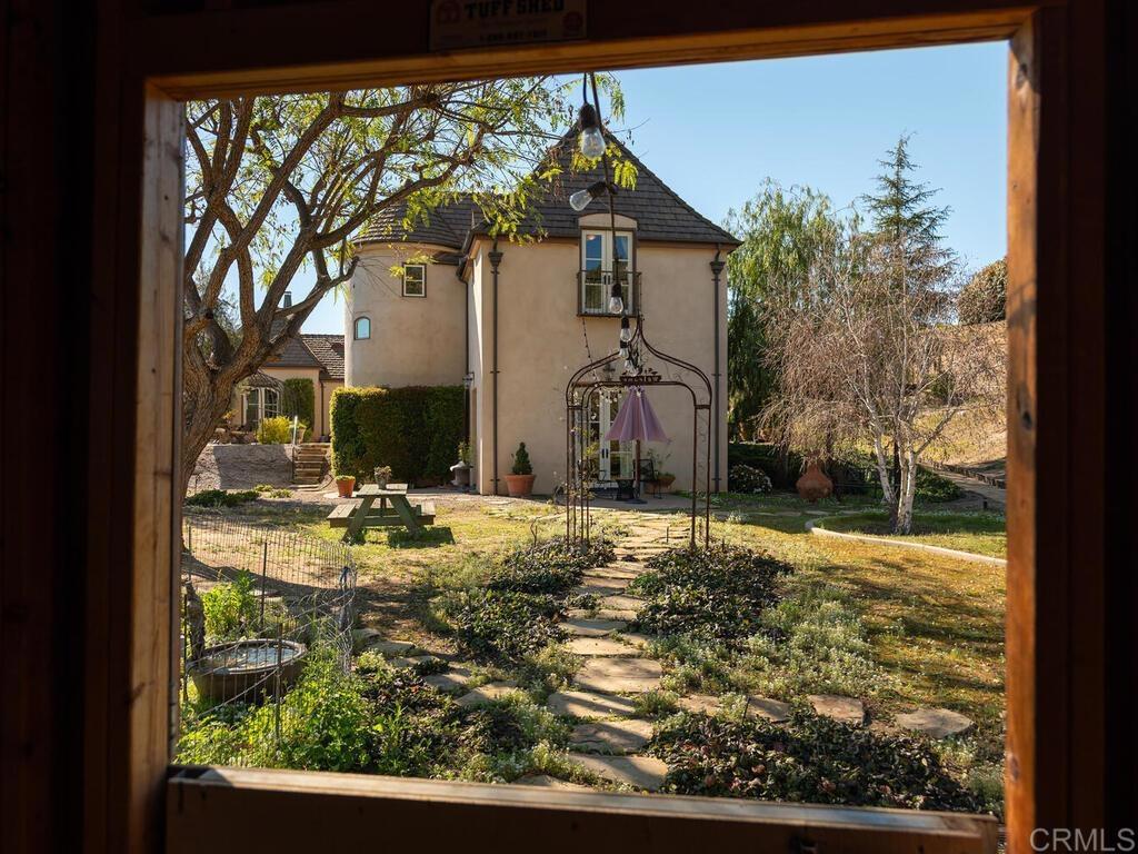 31267 Rancho Amigos Road Bonsall, CA 92003 - Photo 3 of 74 a view of a house with a yard