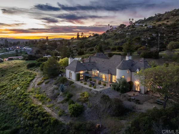 an aerial view of residential houses and outdoor space
