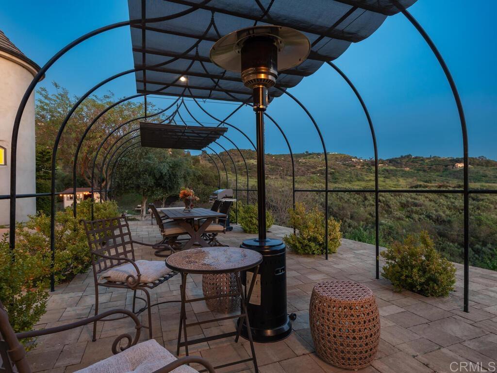 31267 Rancho Amigos Road Bonsall, CA 92003 - Photo 56 of 74 a view of a chair and tables in the patio