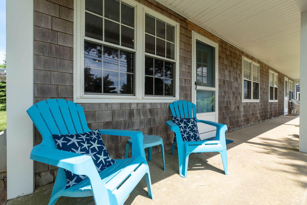 170 Beach Road, Unit 2A Orleans, MA 02653 - Photo 2 of 11 a view of a two chairs in the patio