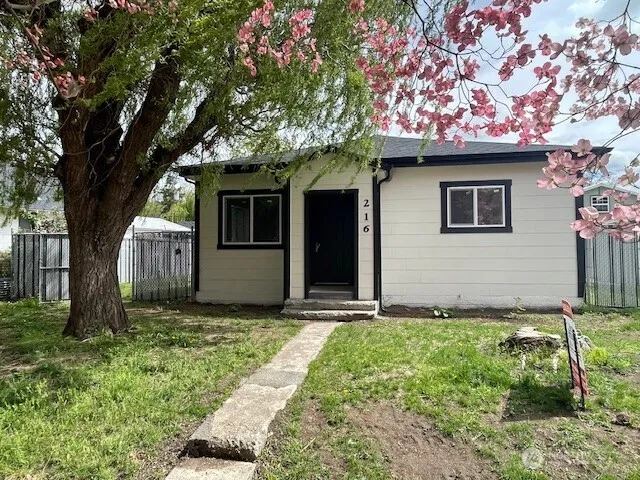 a house with trees in front of it