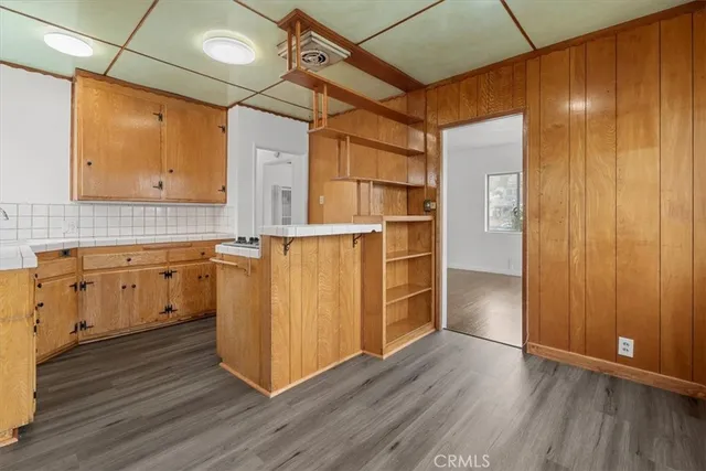 an entryway with wooden floors