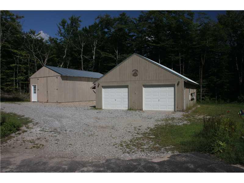 972 Folly Road Sebago, ME 04029 - Photo 3 of 12 Garage. Heated garge and boat house.
