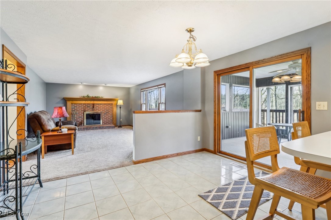 3530 State Road Medina, OH 44256 - Photo 13 of 47 Carpeted living room with a brick fireplace