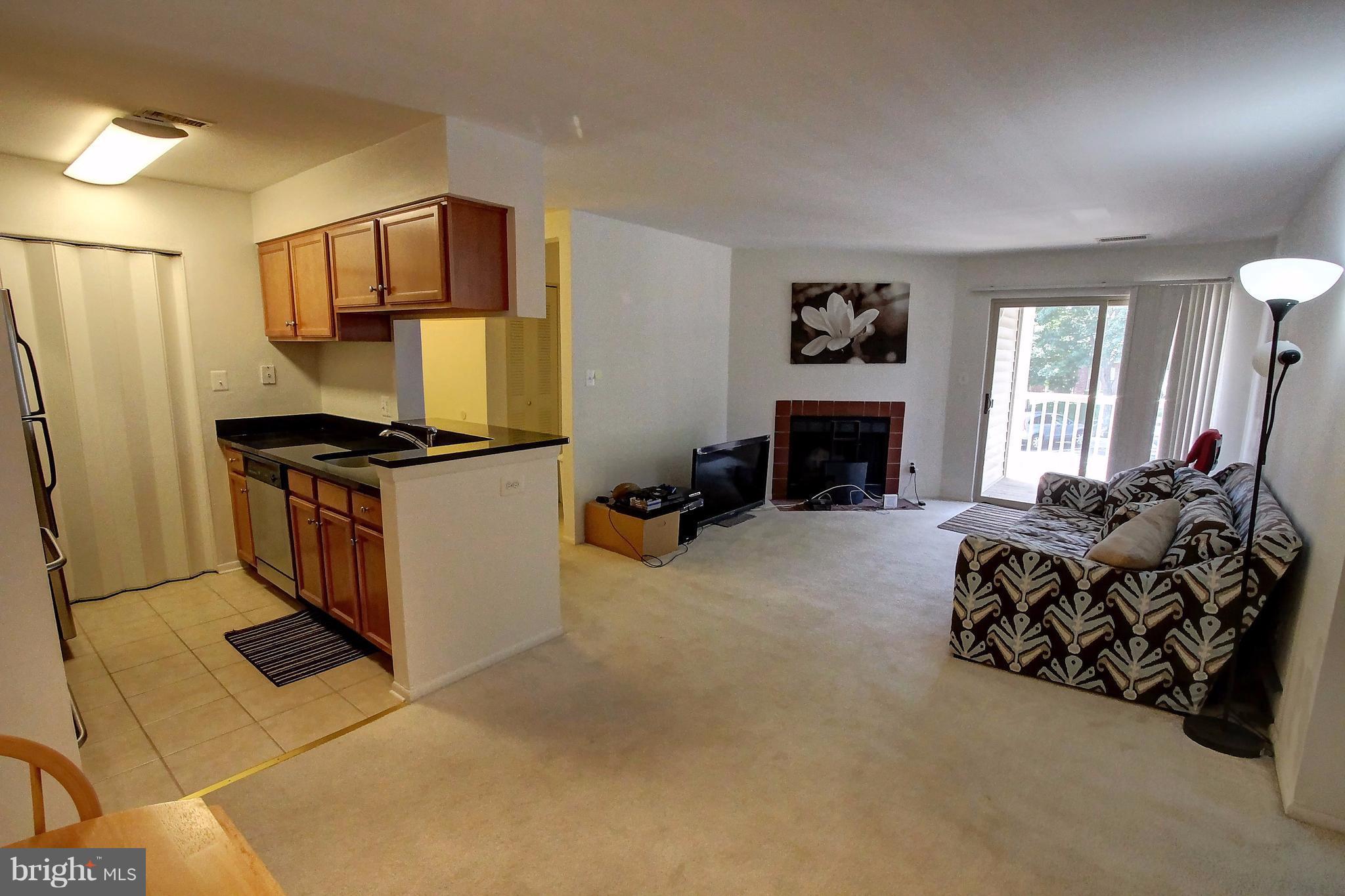 1703 Ascot Way, Unit E Reston, VA 20190 - Photo 7 of 24 Living Room/Kitchen