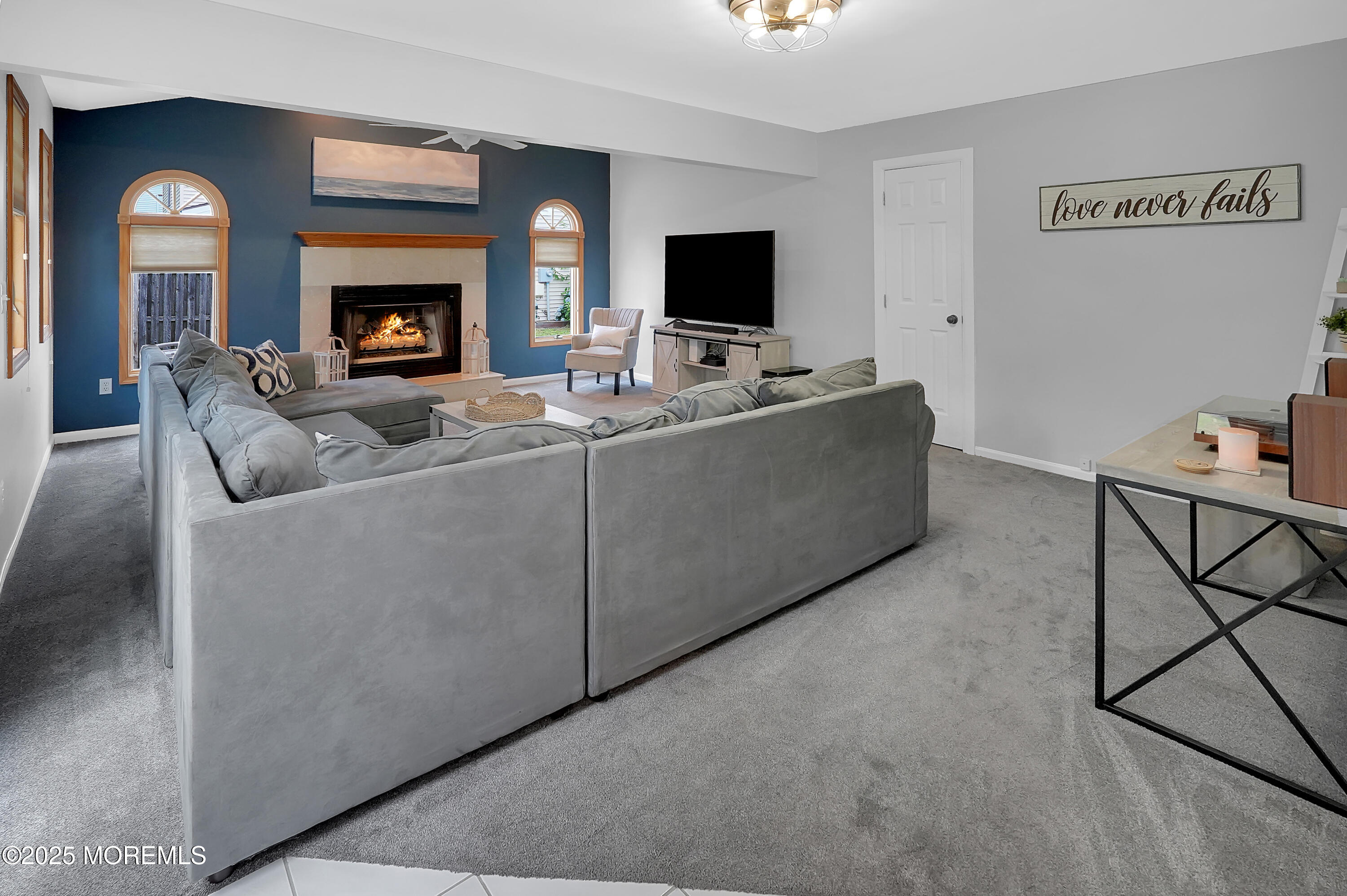 12 Quailtree Lane Howell, NJ 07731 - Photo 15 of 51 a living room with furniture and a fireplace