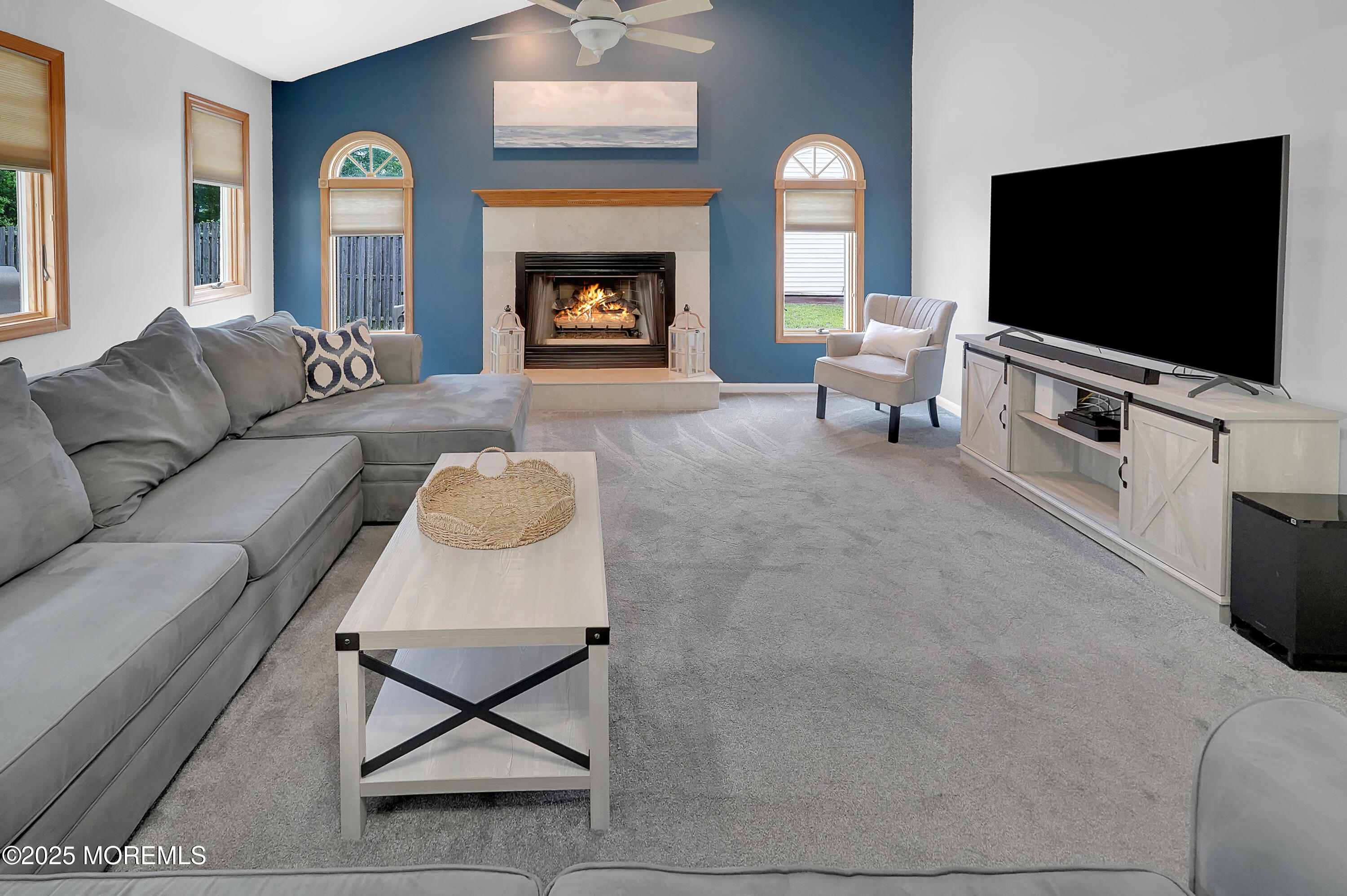 12 Quailtree Lane Howell, NJ 07731 - Photo 18 of 51 a living room with furniture and a flat screen tv