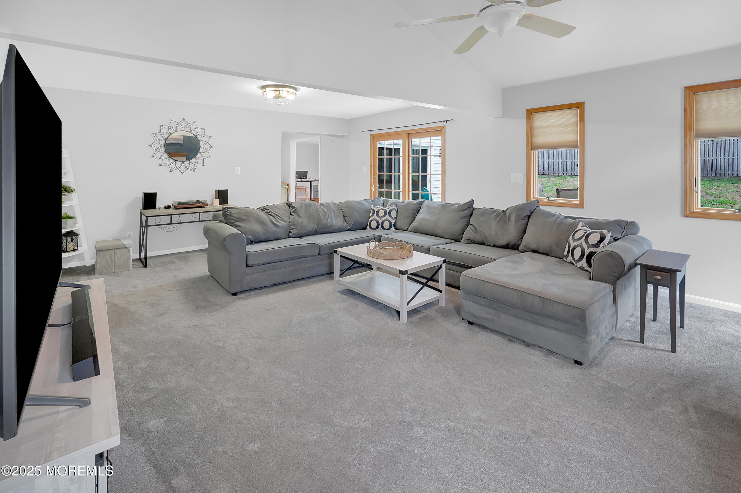 12 Quailtree Lane Howell, NJ 07731 - Photo 19 of 51 a living room with furniture and a flat screen tv