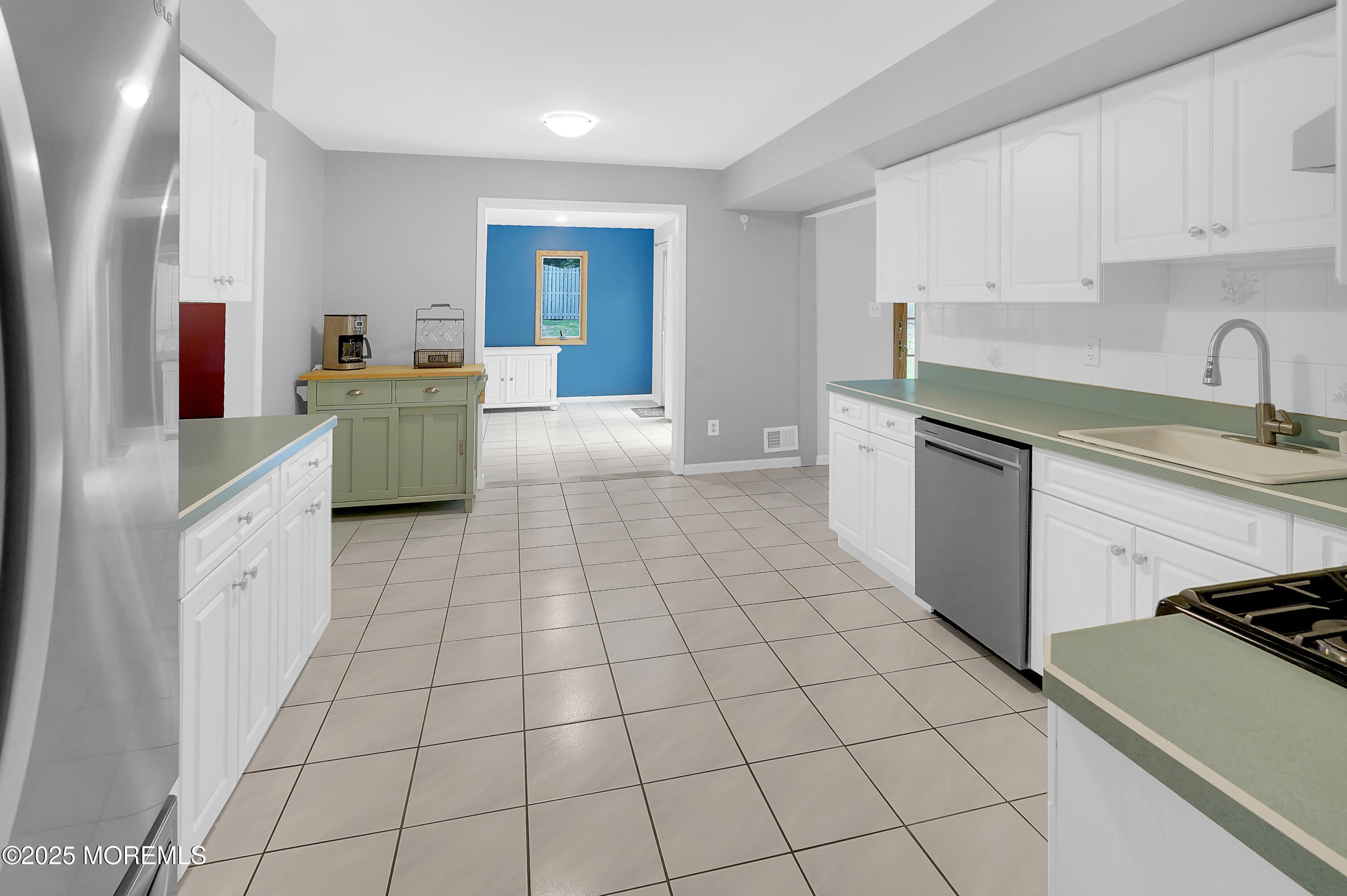 12 Quailtree Lane Howell, NJ 07731 - Photo 25 of 51 a kitchen with stainless steel appliances a sink stove and cabinets