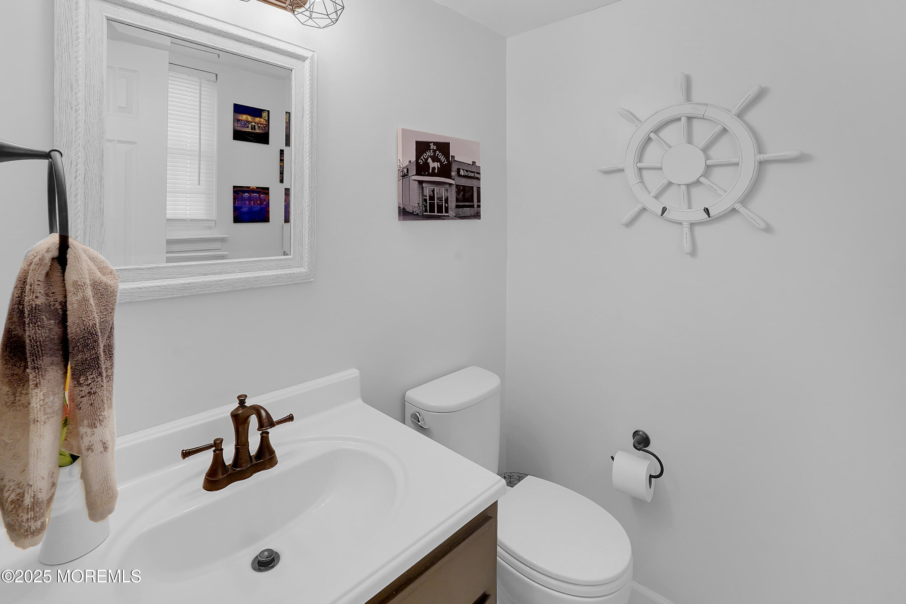 12 Quailtree Lane Howell, NJ 07731 - Photo 27 of 51 a bathroom with a sink vanity mirror and toilet