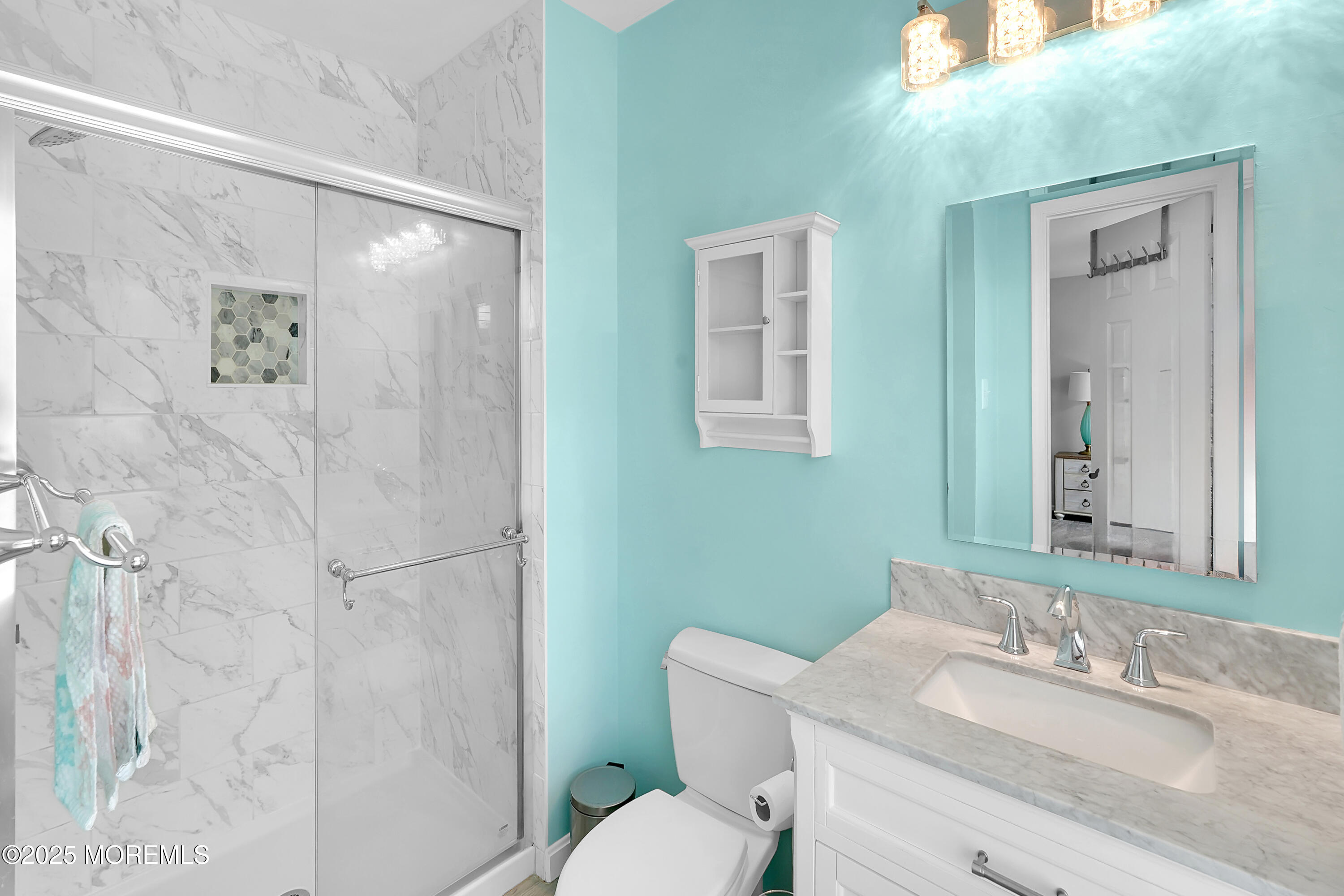 12 Quailtree Lane Howell, NJ 07731 - Photo 34 of 51 a bathroom with a granite countertop sink toilet a mirror and shower