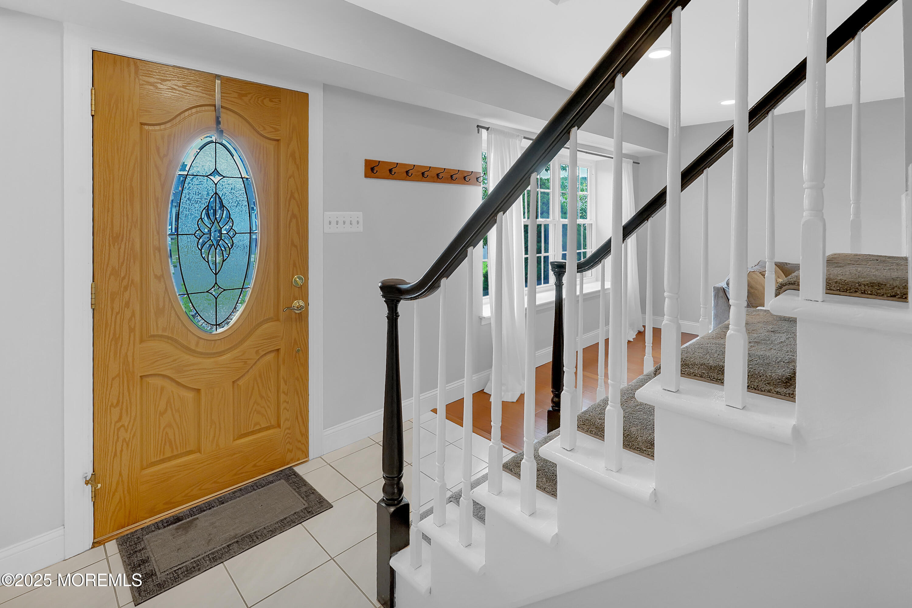 12 Quailtree Lane Howell, NJ 07731 - Photo 40 of 51 a view of entryway dining room and hall with wooden floor