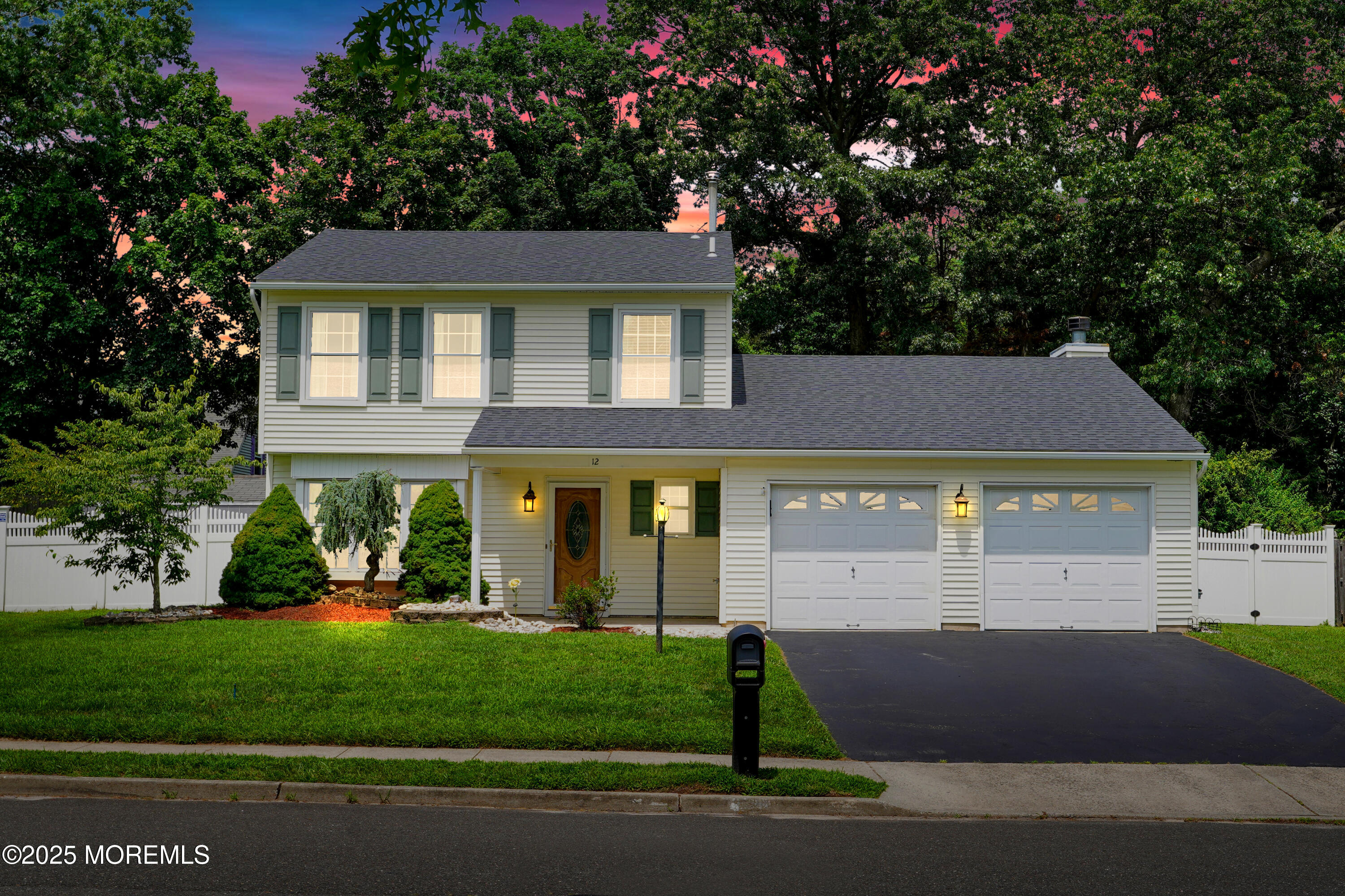 12 Quailtree Lane Howell, NJ 07731 - Photo 4 of 51 a view of a yard in front of a house