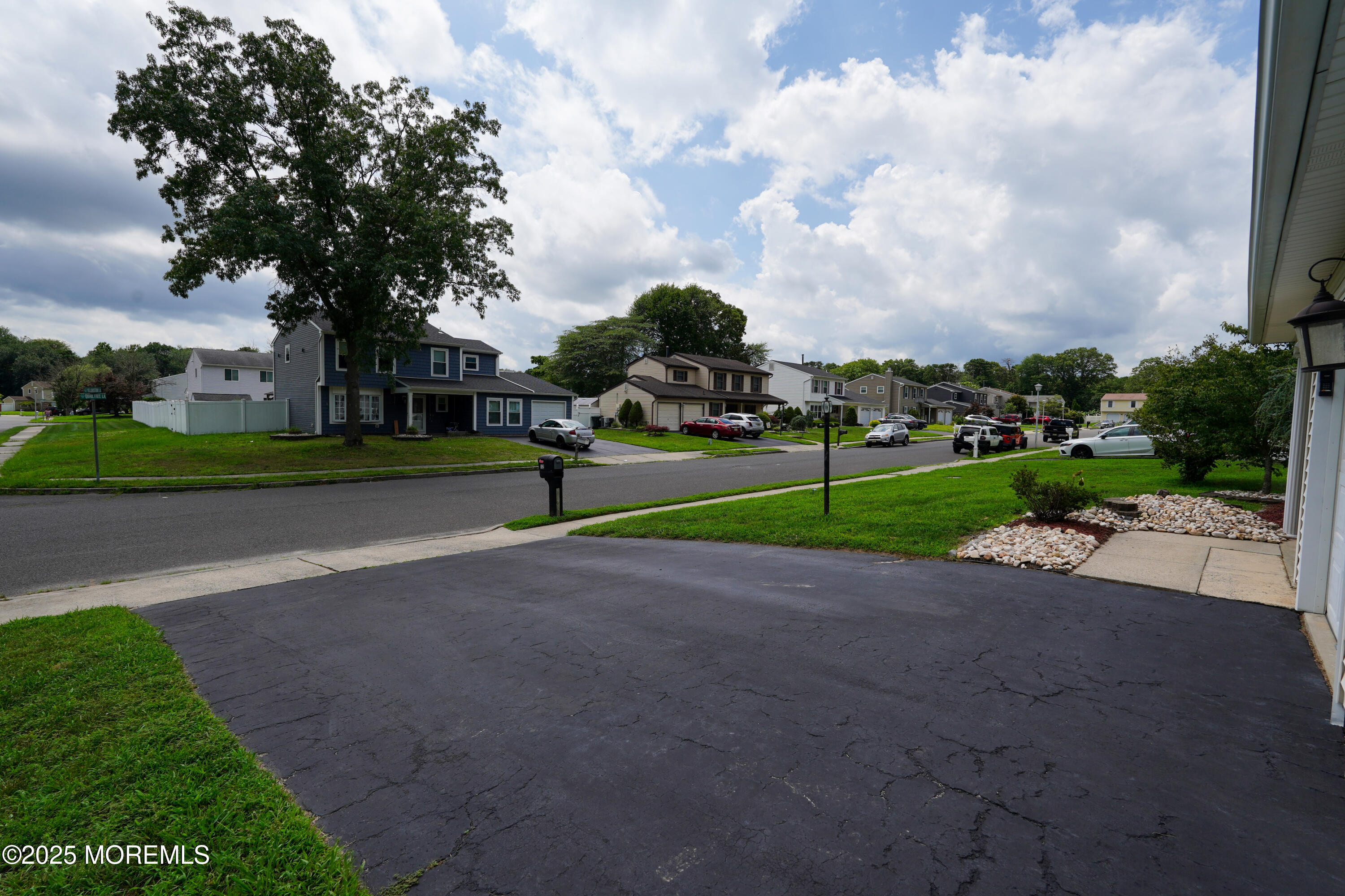 12 Quailtree Lane Howell, NJ 07731 - Photo 42 of 51 a view of a park with swings and slides